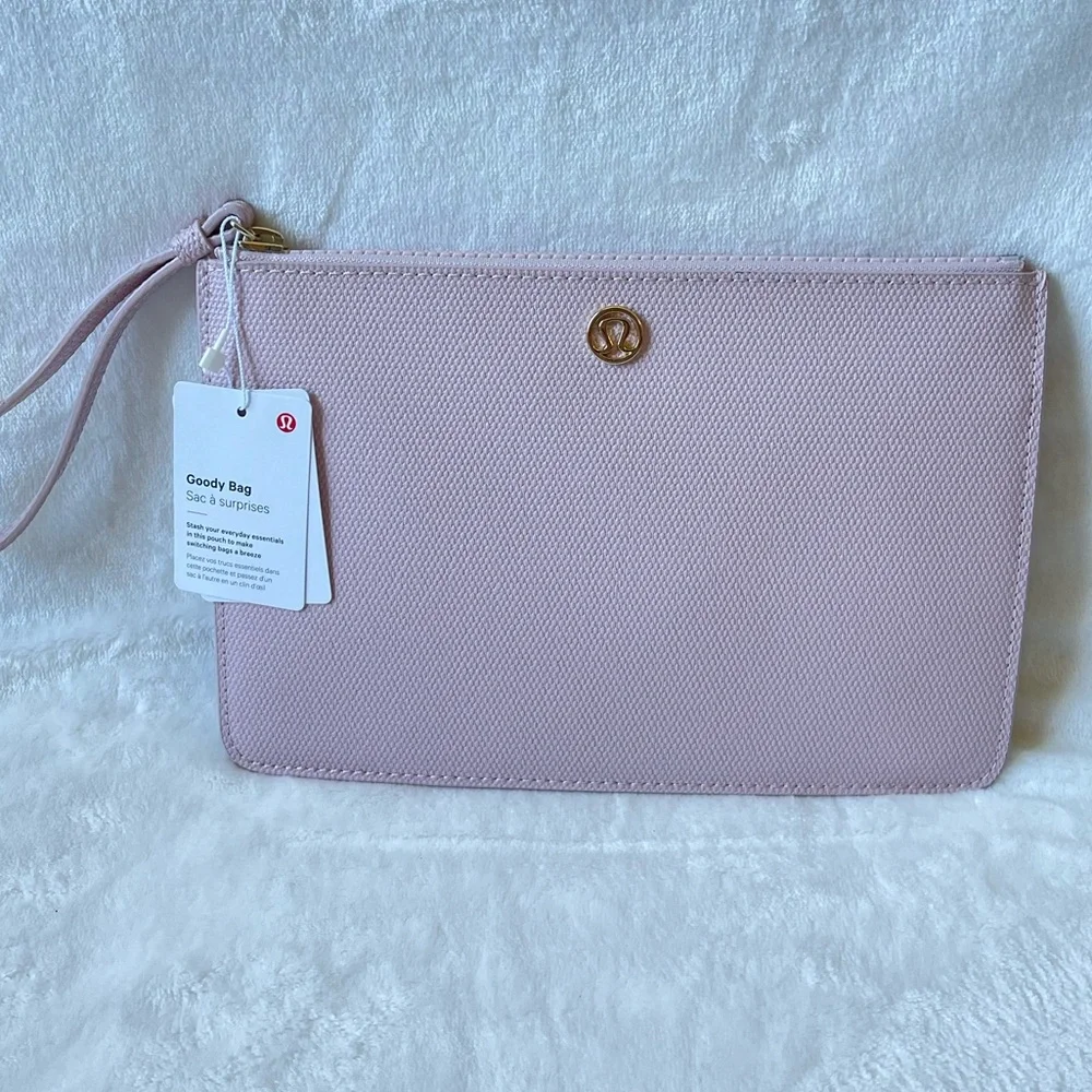 Lululemon Pink Clutch Wristlet Gold Logo Minimalist Goody Bag New with tags